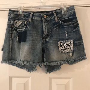 Cato Distressed blue jean shorts.